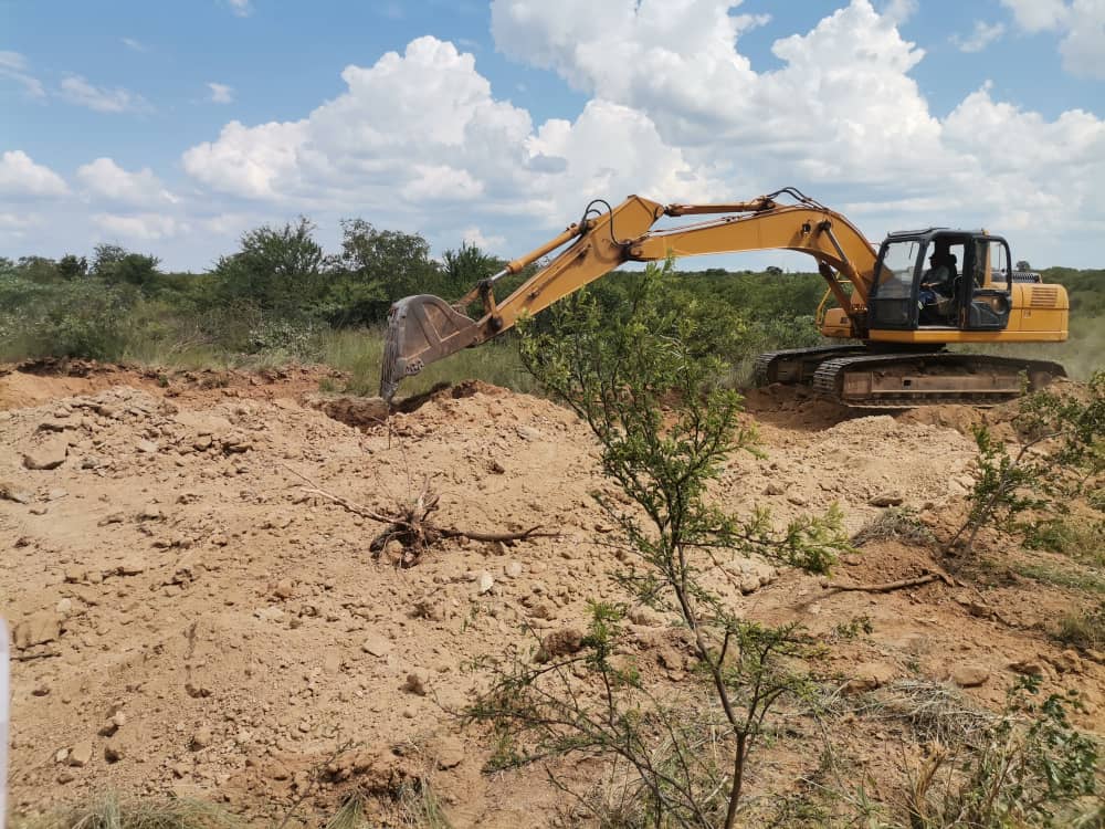 Excavator clearing land for township roads at Rangemore